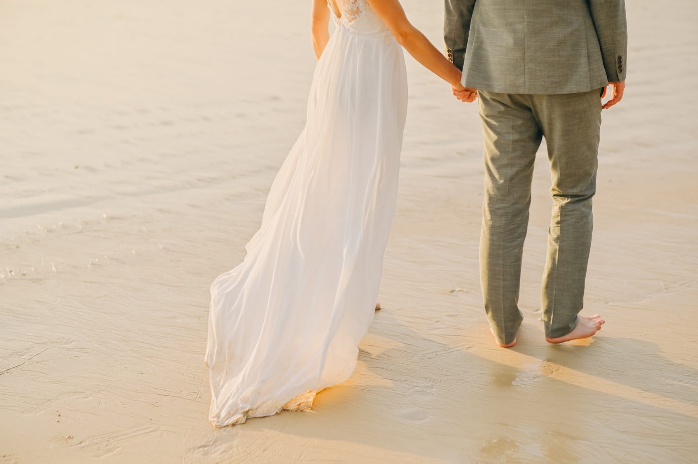 Barefoot wedding couple on the beach in Khao Lak