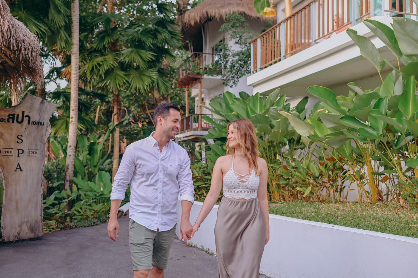 Couple walking through a resort garden in Khao Lak