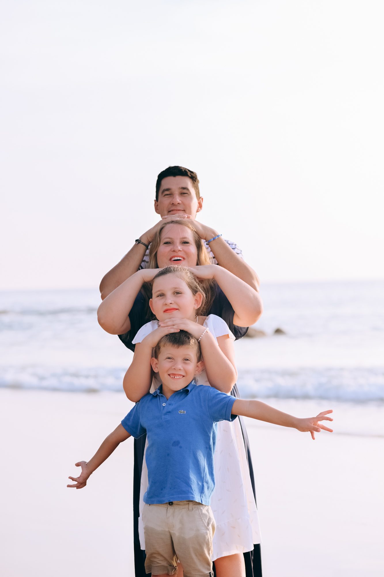 Family stacked portrait pose on the beach in Khao Lak