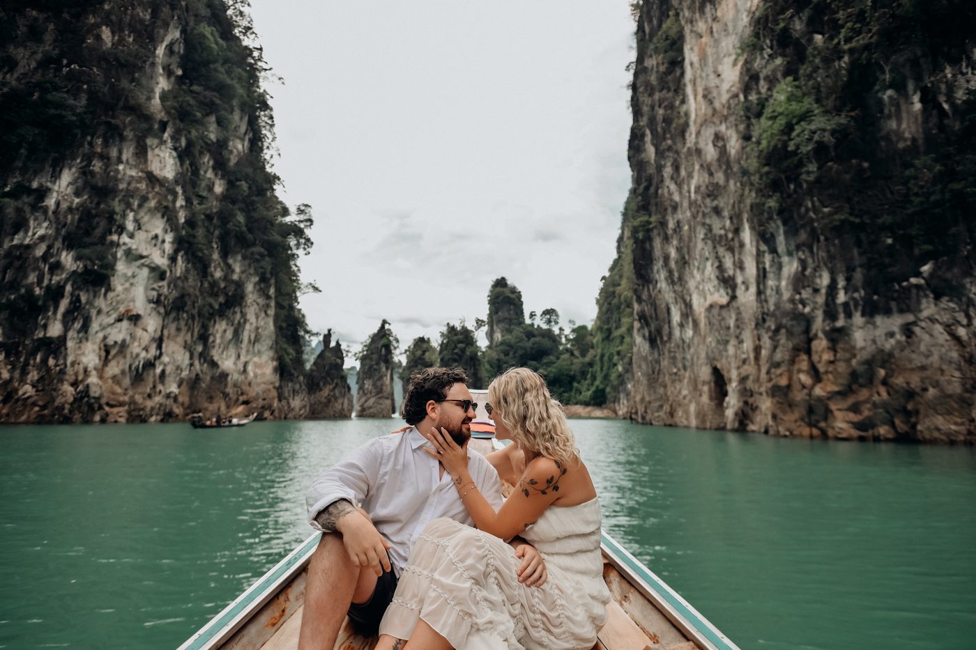 Honeymoon couple on a longtail boat at Khao Sok, Cheow Lan Lake
