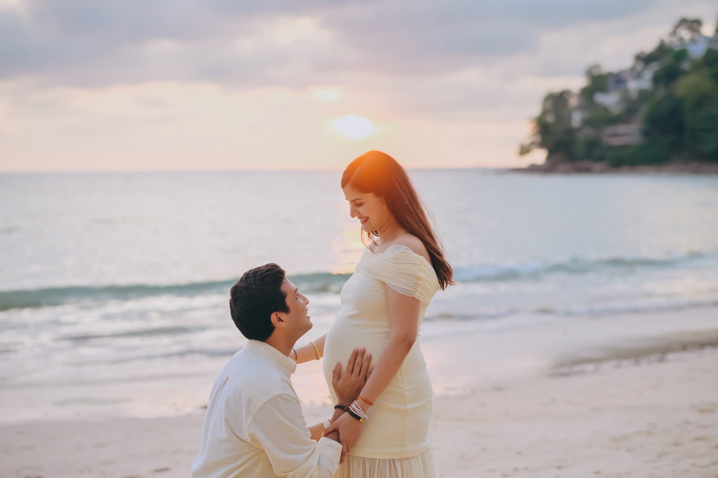 Maternity couple portrait on the beach at sunset in Khao Lak